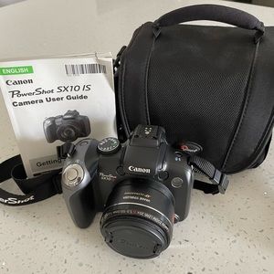 Digital Canon power shot SX10IS camera with case and instruction manual
